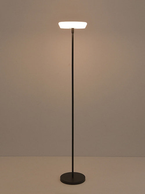 Arco solar cordless floor lamp with a glowing white disc on a black pole